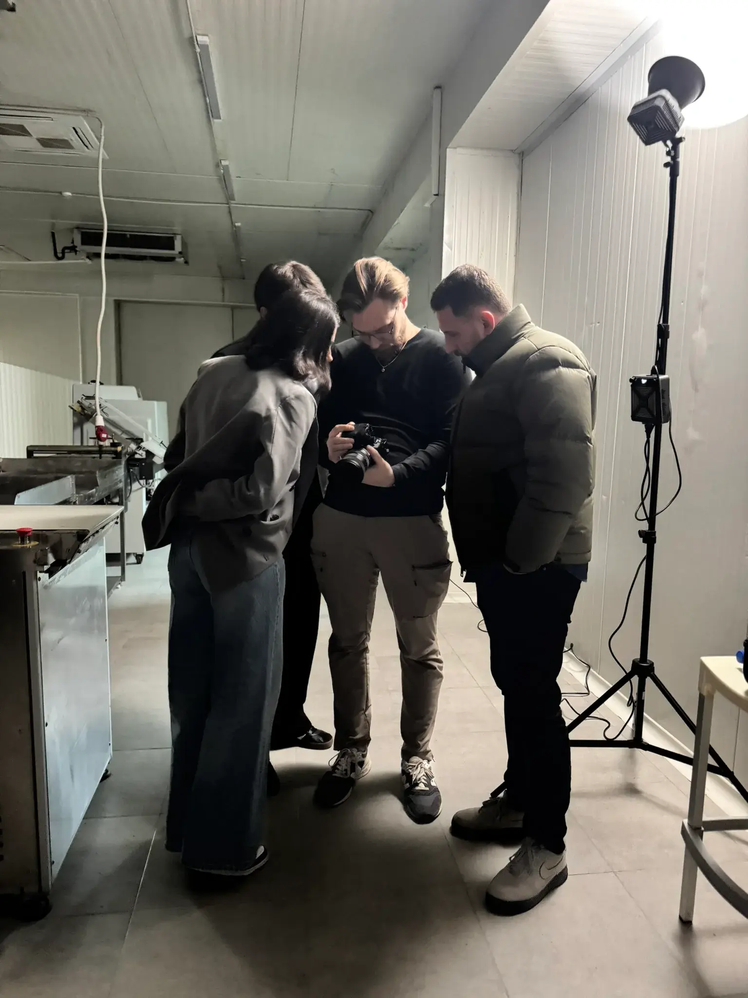Why Agency collaborators reviewing footage on a camera